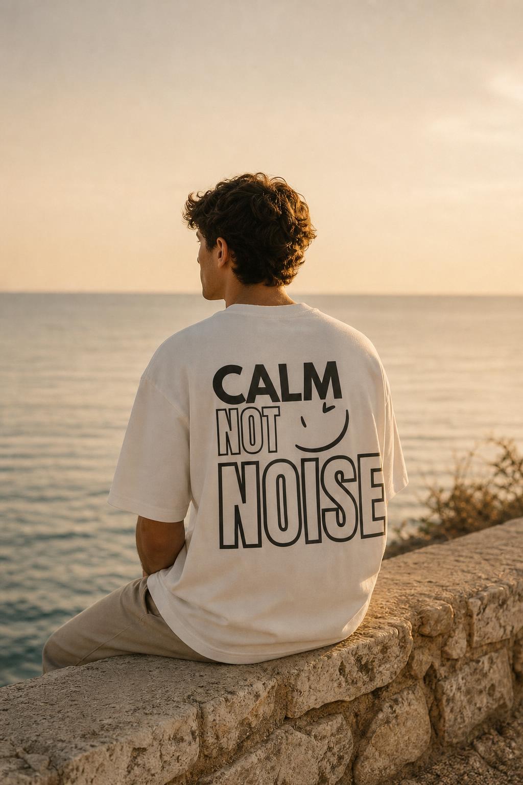 Calm Not Noise back print, sitting by the sea